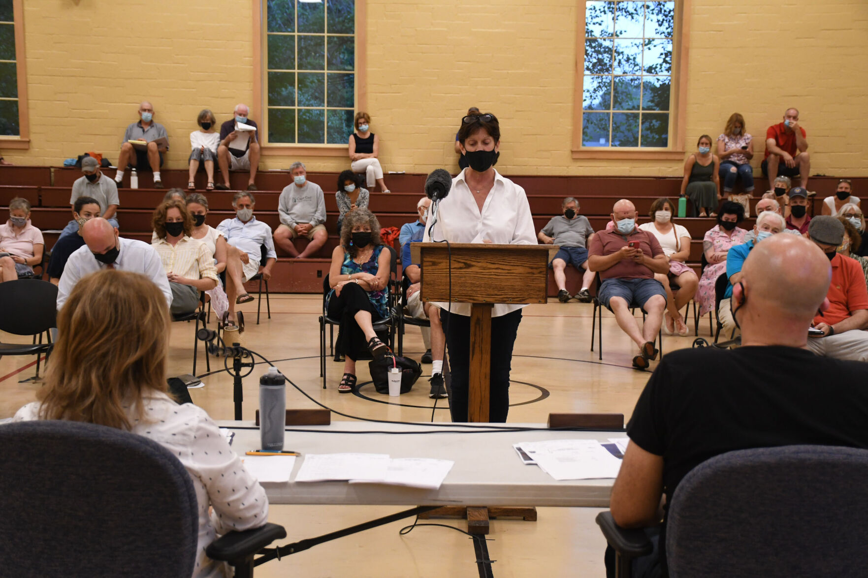 Amy Brentano speaks at the podium